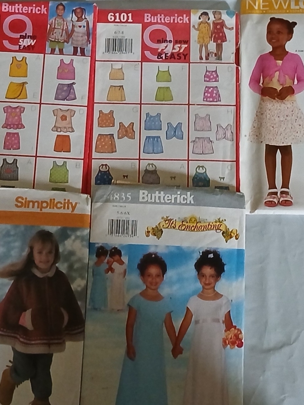 Asdorted Girls' Sewing Pattern Lot with Dresses and Tops - Pink, Blue, White